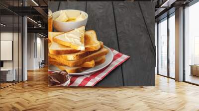 Slice of fresh bread with butter and jam on table Wall mural