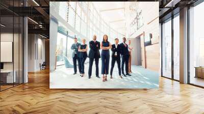 Successful team of young perspective businesspeople in office Wall mural