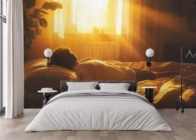 Sunny morning light streams into a cozy bedroom where a person enjoys relaxation on a bed near a window Wall mural