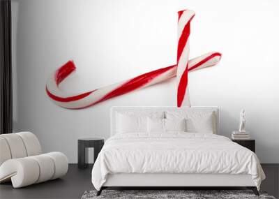 Two candy canes isolated on white background Wall mural