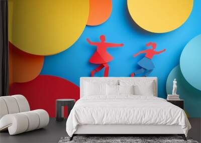 Two paper cutout figures dance joyfully against a vibrant blue background with colorful circular shapes Wall mural