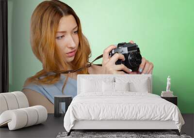 Woman photographer with camera Wall mural