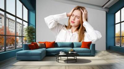 Woman With Hands on Head Suffering Headache Wall mural