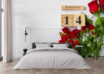 Wooden calendar 14th February and roses on white background Wall mural