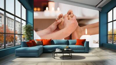 Perfect clean female foot . Beautiful and elegant groomed girl's hand touches her feet . Spa ,scrub and leg care . Wall mural