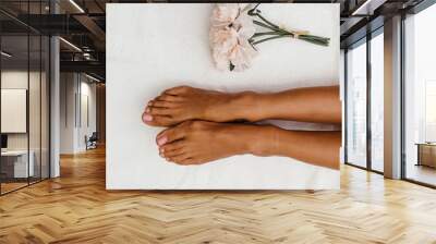 Relaxing massage on the foot in spa salon - indoors Wall mural