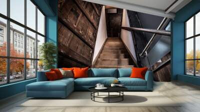 Old wooden stairs going down to a basement Wall mural