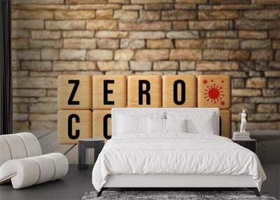 cubes with message ZERO COVID in front of a brick wall background Wall mural