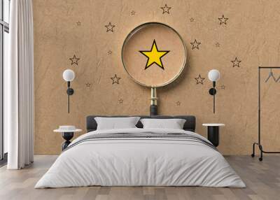 magnifying glass with a yellow star mark as symbol for finding a solution on paper background Wall mural