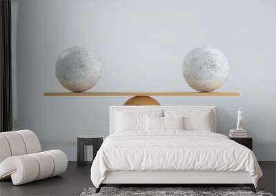 wooden scale balancing two big balls in front white background Wall mural