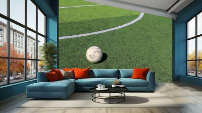 Football on artificial turf. It is for green background in a stadium Wall mural