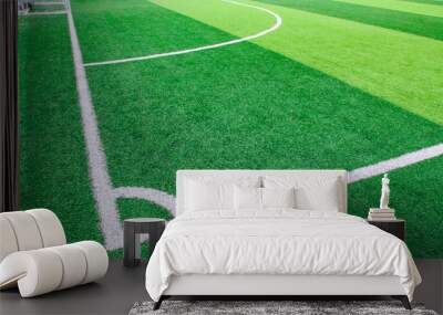 Photo of a green synthetic grass sports field with white line shot from above Wall mural