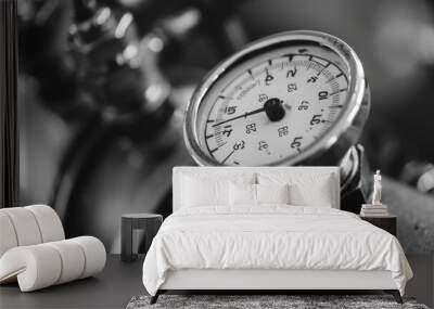 A black and white photo of a pressure gauge, suitable for industrial concepts Wall mural