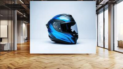 A blue and black helmet sits on a white surface Wall mural