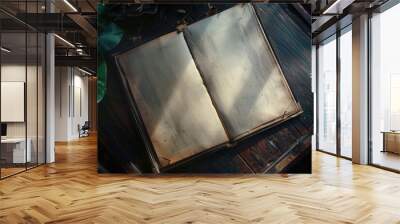 A book lying on a wooden surface, possibly for reading or studying Wall mural