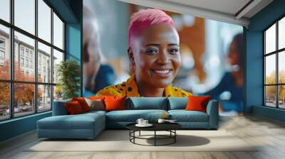 A cheerful woman with pink hair smiling directly at the camera Wall mural