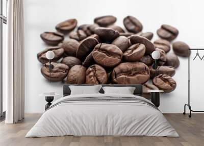 A close-up view of a pile of coffee beans on a white surface Wall mural