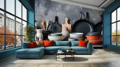 A collection of dishes and pans arranged on a table. Suitable for kitchen-related designs and cooking themes Wall mural