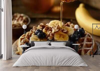 A delicious waffle topped with fresh bananas, blueberries, and walnuts Wall mural