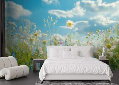 A field of colorful flowers against a bright blue sky, perfect for nature and landscape uses Wall mural