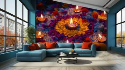 A group of lit candles sits atop a bed of colorful flowers Wall mural