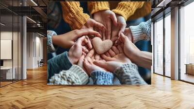 A group of people holding hands around a heart. Can be used to symbolize unity, love, and support Wall mural