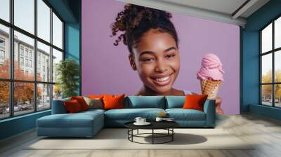 A happy young girl enjoying her favorite treat on a sunny day Wall mural