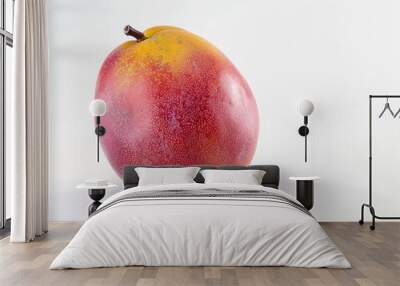 A juicy red and yellow mango sits on a white surface, ready for eating or display Wall mural