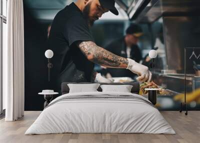 A man in a black shirt and white gloves cooking food, suitable for culinary concepts Wall mural