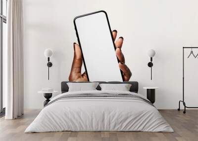 A person holding a smartphone with a blank white screen, possibly waiting for an important call or message Wall mural