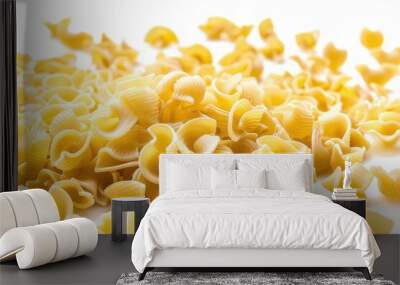 A pile of uncooked pasta on a clean white surface, great for illustrating food preparation or kitchen scenes Wall mural