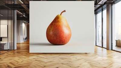 A single pear sitting on a white surface, great for food or still life photography Wall mural