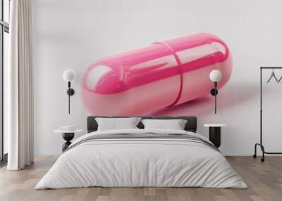 A single pink pill sits on a clean white surface, ready for use Wall mural