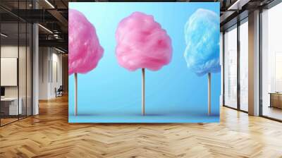 A single serving of fluffy cotton candy floss on a colorful stick, set against a bright blue background Wall mural