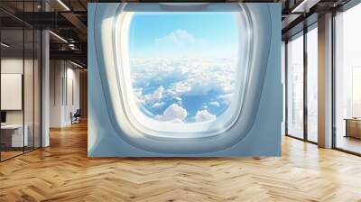 A view of the sky through an airplane window with clouds and sunlight Wall mural