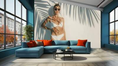 A woman poses in a white bikini, perfect for summer or beach-themed photography Wall mural