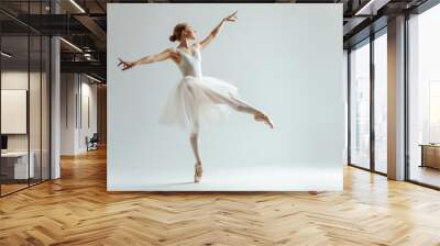 A woman wearing a white dress is dancing, possibly at a wedding or party Wall mural