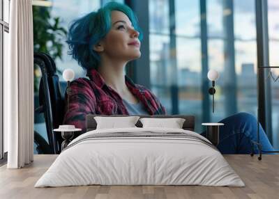 A woman with striking blue hair sits in a chair, ready for conversation Wall mural