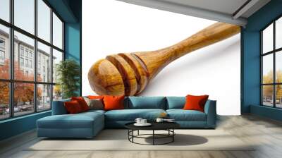 A wooden spoon with a wooden handle on a white surface Wall mural