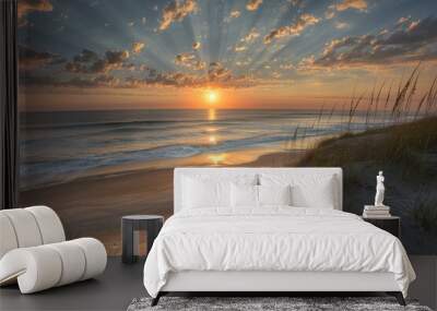 Beach scene at sunset with ocean waves and sky colors Wall mural