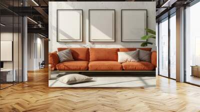 Cozy living room interior with an orange couch, two framed pictures on the wall, and a warm atmosphere Wall mural