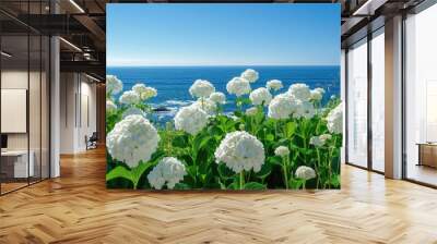 Field of white flowers overlooking the ocean Wall mural