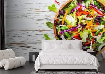 Fresh salad in a rustic wooden bowl, perfect for healthy eating concept Wall mural