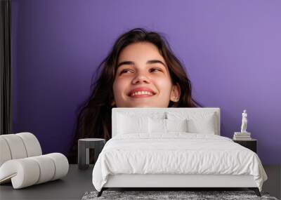 Portrait of a smiling woman with long brown hair, looking directly at the camera Wall mural