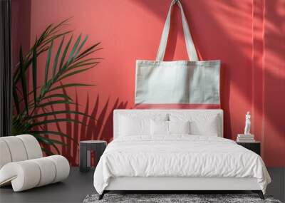 Tote bag hanging on a wall next to a plant. Perfect for lifestyle or home decor concepts Wall mural