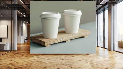 Two ceramic cups filled with coffee sit on a wooden stand Wall mural