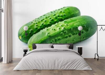 Two fresh green cucumbers sit on a clean white surface Wall mural