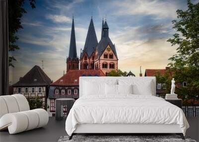 Half-timbered houses in the old town of Gelnhausen / Germany and the Marien Church in the background  Wall mural