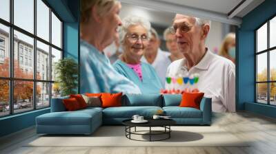 '' nursing home staff and residents celebrating a birthday with a cake and decorations in the common area  Wall mural