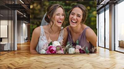 A bride and bridesmaid laughing together representing friendship and shared joy  Wall mural